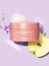 Exuviance produkten advanced toning neck cream mot lila bakrund med ingredienser runt omkring.